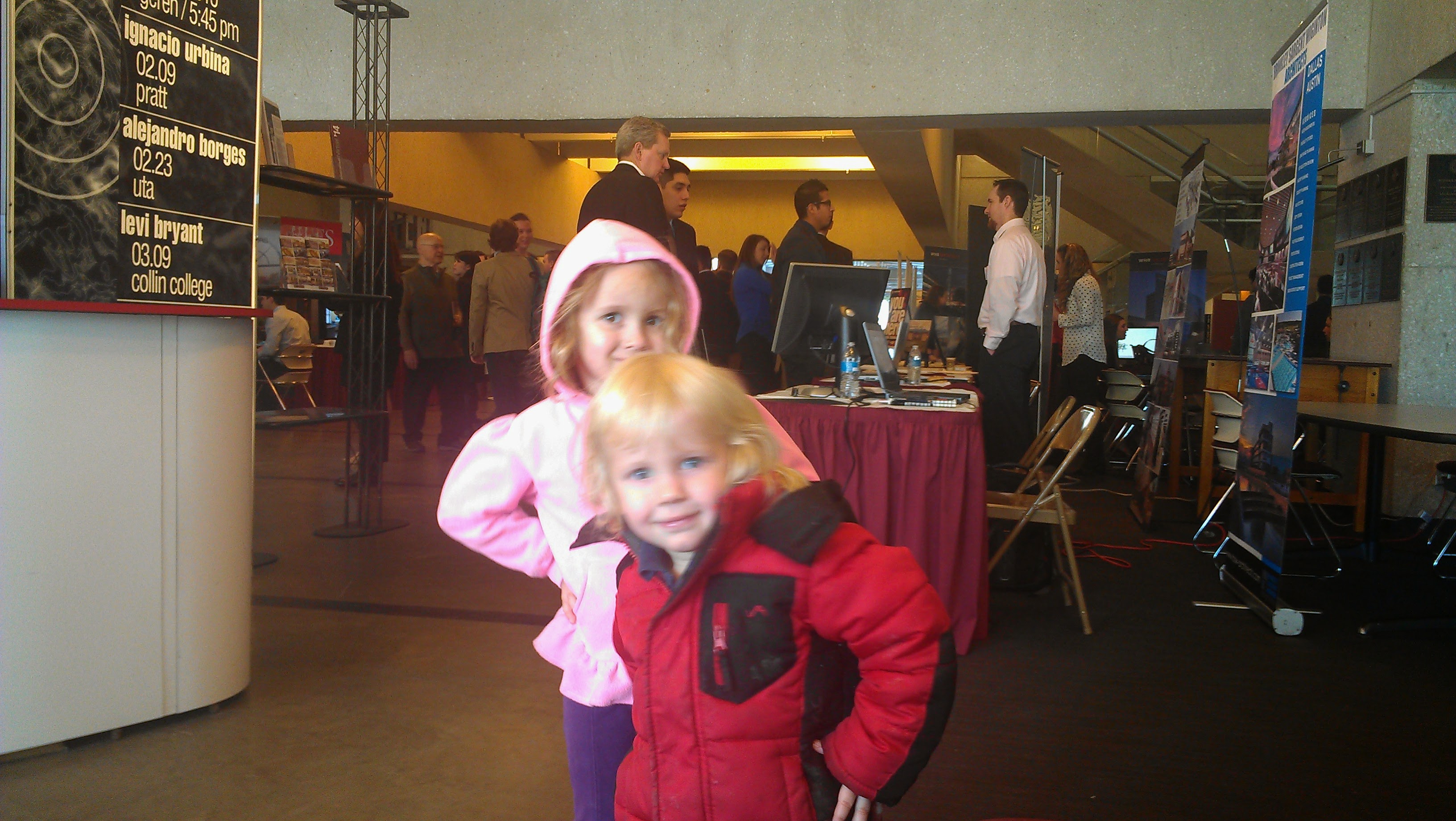 Two toddlers at a University career fair